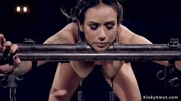 Hot Big Tits Brunette Sub Bent Over Bound In Metal Device With Nipples Clamped And Weighted