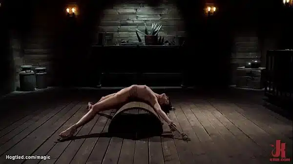 Bound To Wooden Pony In Squat Position With Legs And Hands Spreaded Wide Brunette Slave Kristen Scott Gets Clamped Then Takes Back Arch Bondage Over Half Barrel By Master The Pope