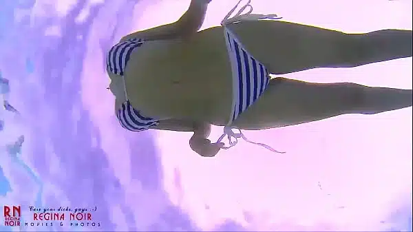 Slut In A Striped Bikini Swimsuit A Bitch Wriggles In The Water Like A Snake Showing Her Ass